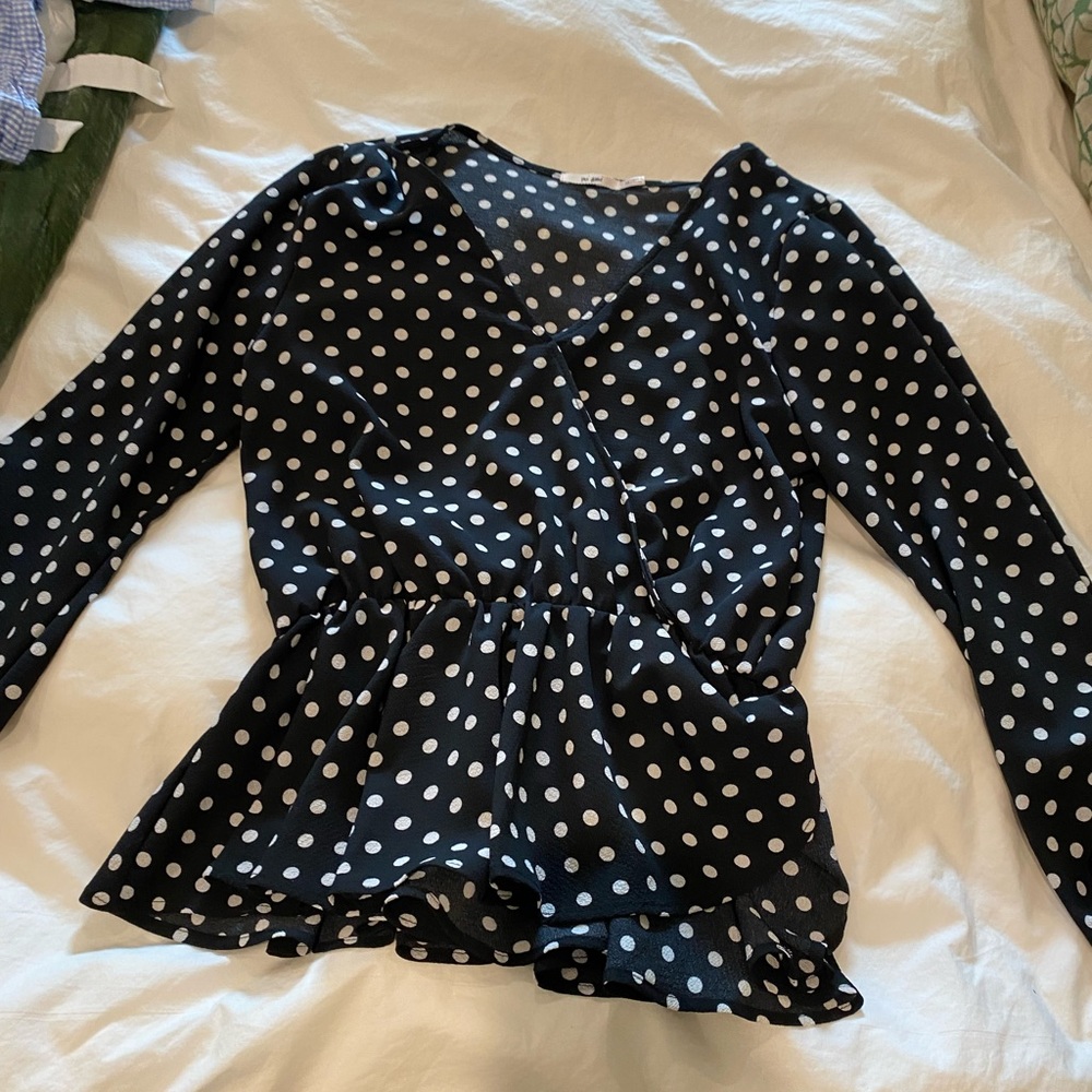 Black with white polka dots. Wrap blouse.